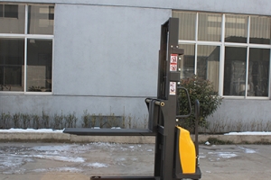 When do I need to replace the fork of a semi-electric stacker?