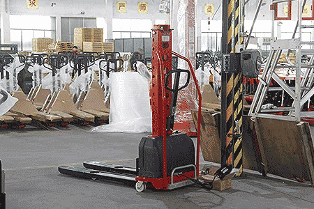 Portable electric self-loading stacker