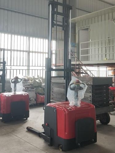 Stand-on double pallet stacker