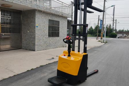 Stand-on double pallet stacker
