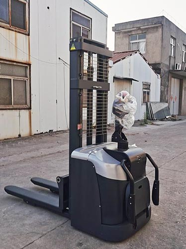 Stand-on electric stacker