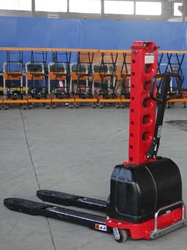 Electric self-loading stacker