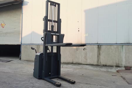 Stand-on electric stacker