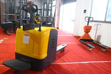 Stand-on electric pallet truck