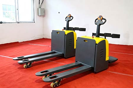 Stand-on electric pallet truck