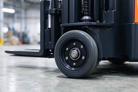 Electric stacker support wheel